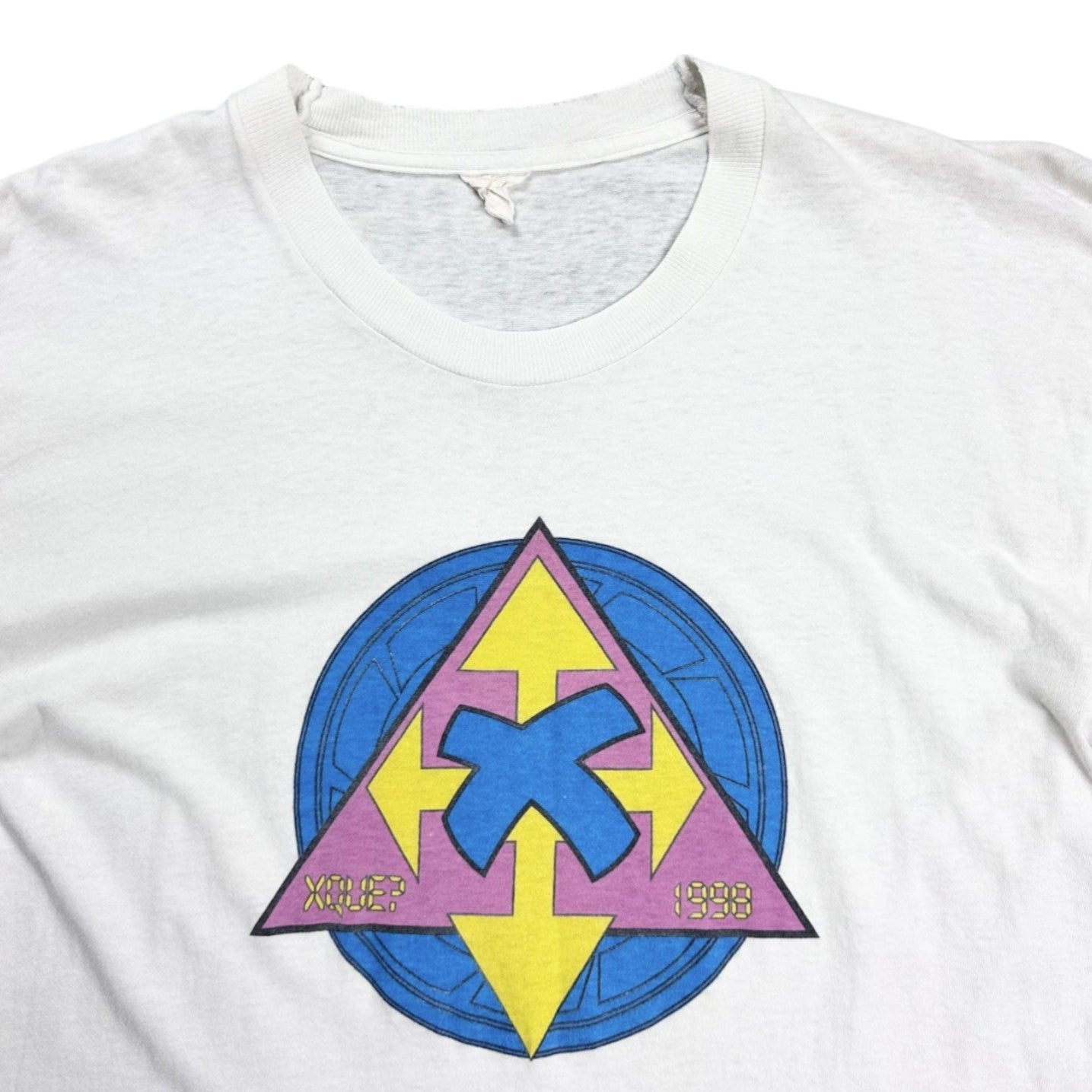 White t-shirt with a colorful geometric design on a white background